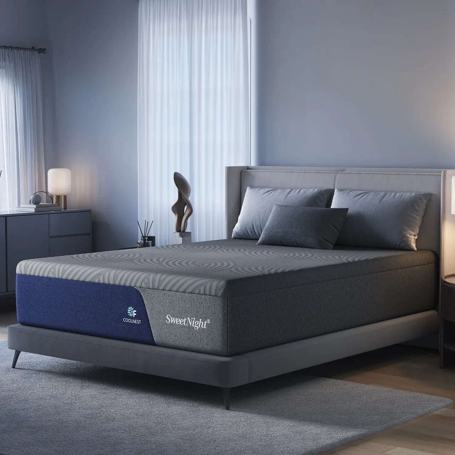 SweetNight CoolNest mattress with gray striped top and blue base on a bed in a bedroom.