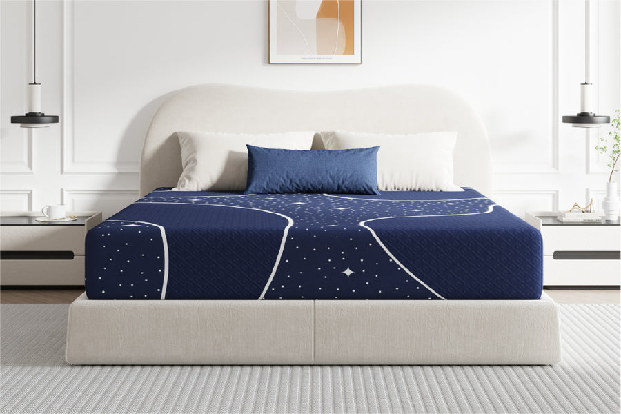 Starry Night Hybrid Mattress with navy blue StarSea cover on a bed, showcasing comfort and spine alignment features.
